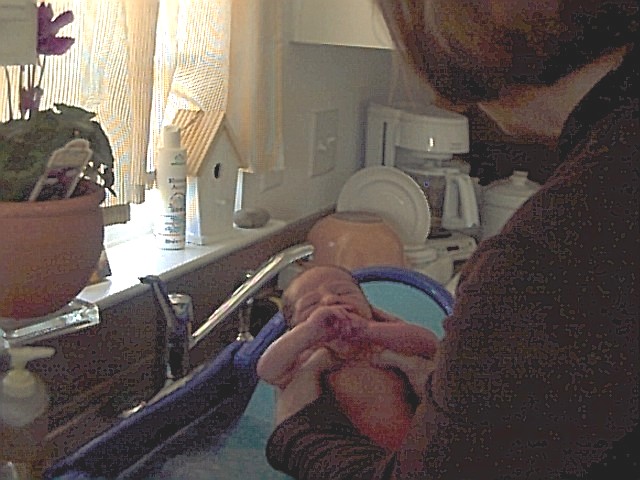 Baby taking a bath; Actual size=240 pixels wide